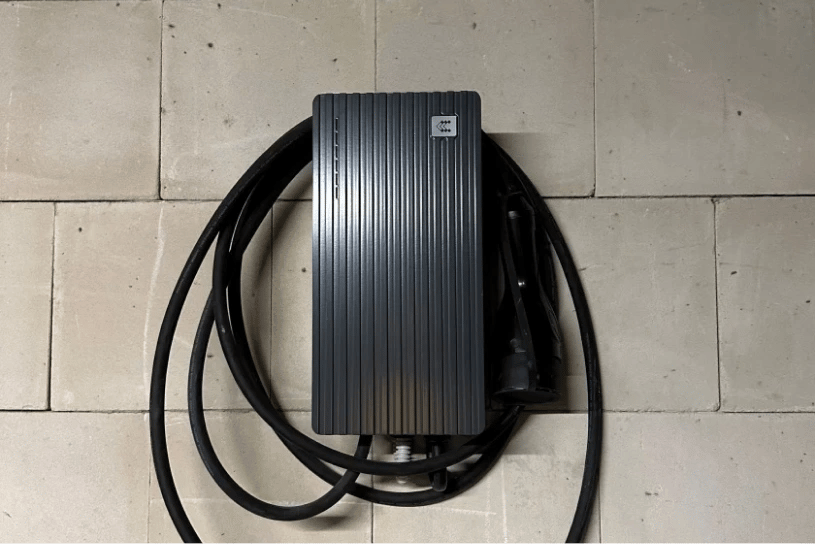 Black TeltoCharge mounted on a wall